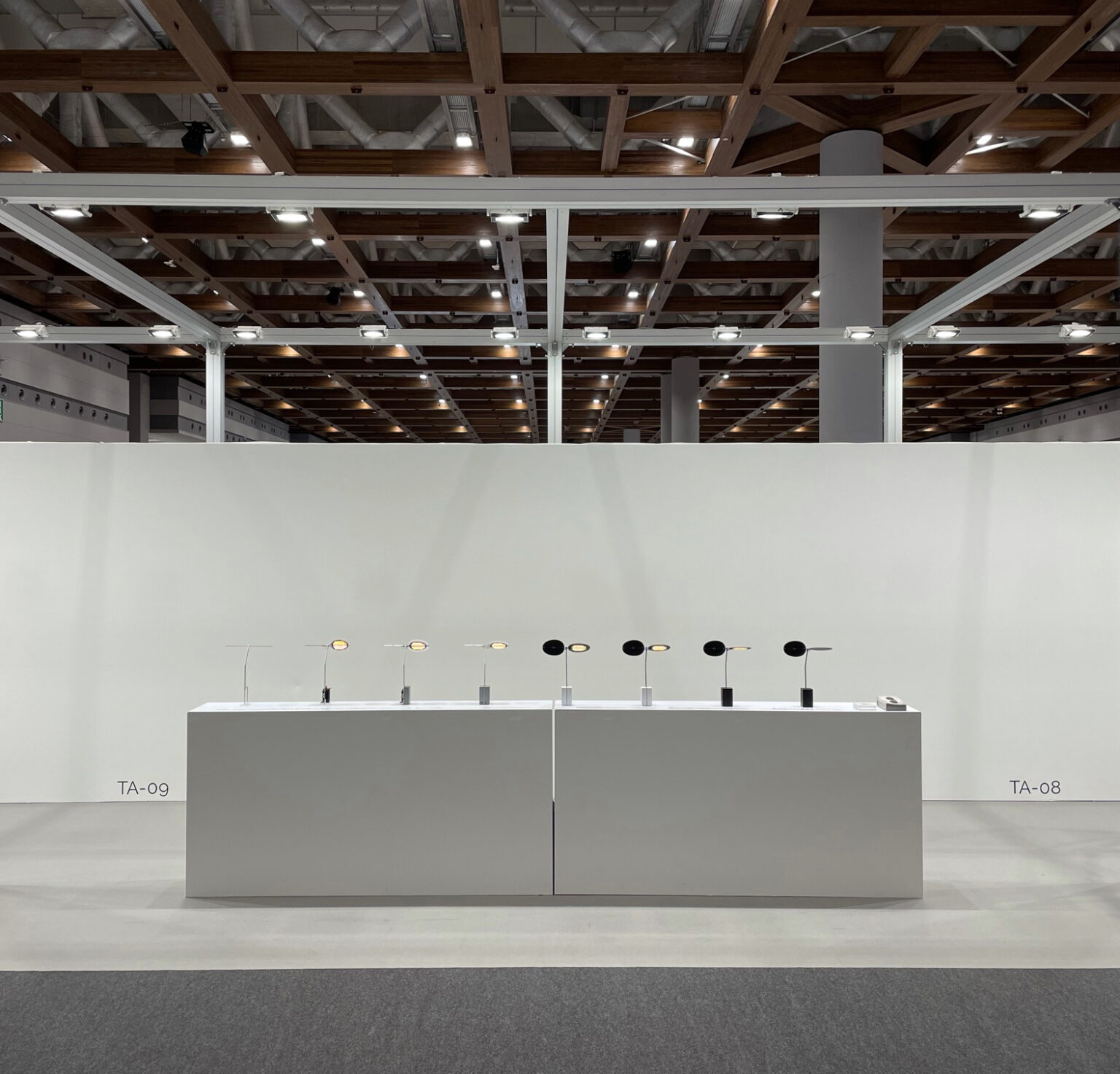SAGE, Ambientec. Design by Nao Tamura. | IFFT Interior Lifestyle Living, Tokyo, 2021—"Making of." Eight SAGE from left to right: bare electronics to finished lamp, the making laid out in a row. Photo: Hiroto Yoshizoe