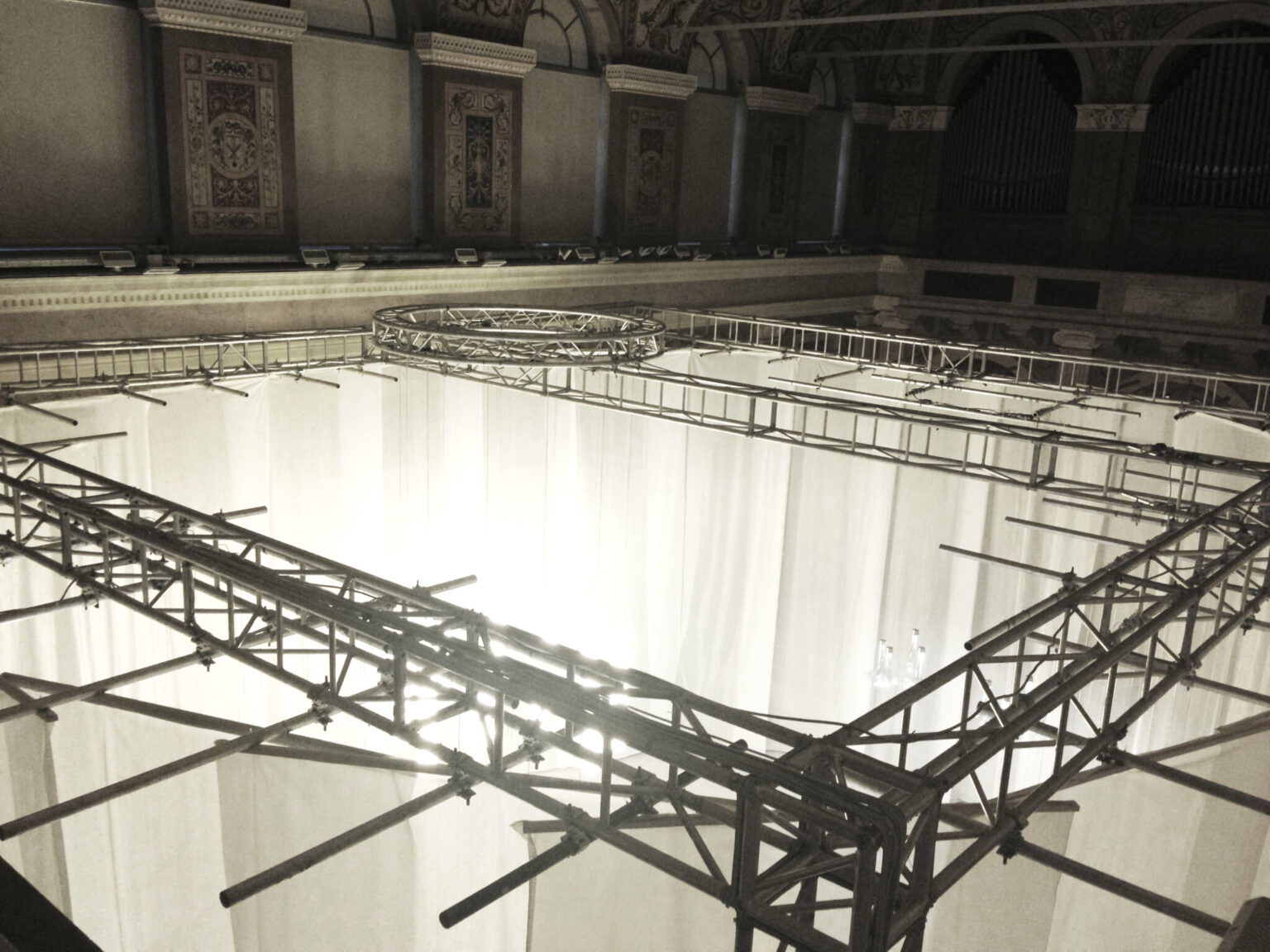 MOVING HORIZON, WonderGlass. Installation by Nao Tamura. | From above: the truss hung from the hall's ceiling, the fabric already in place.