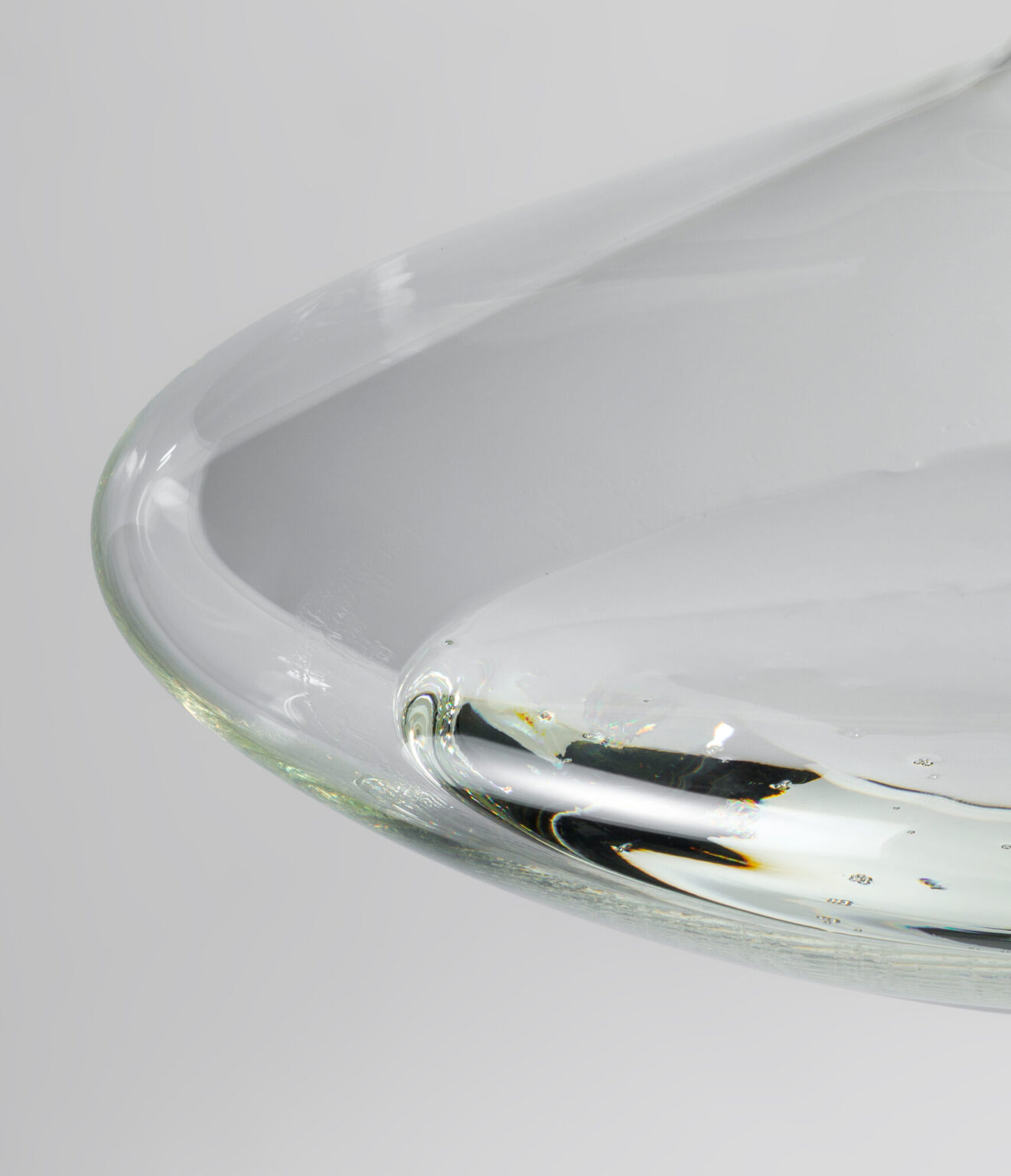 FLUID, WonderGlass. Design by Nao Tamura. | The pool: glass gathered thick at the base, bubbles held mid-rise. This is where the light stays.