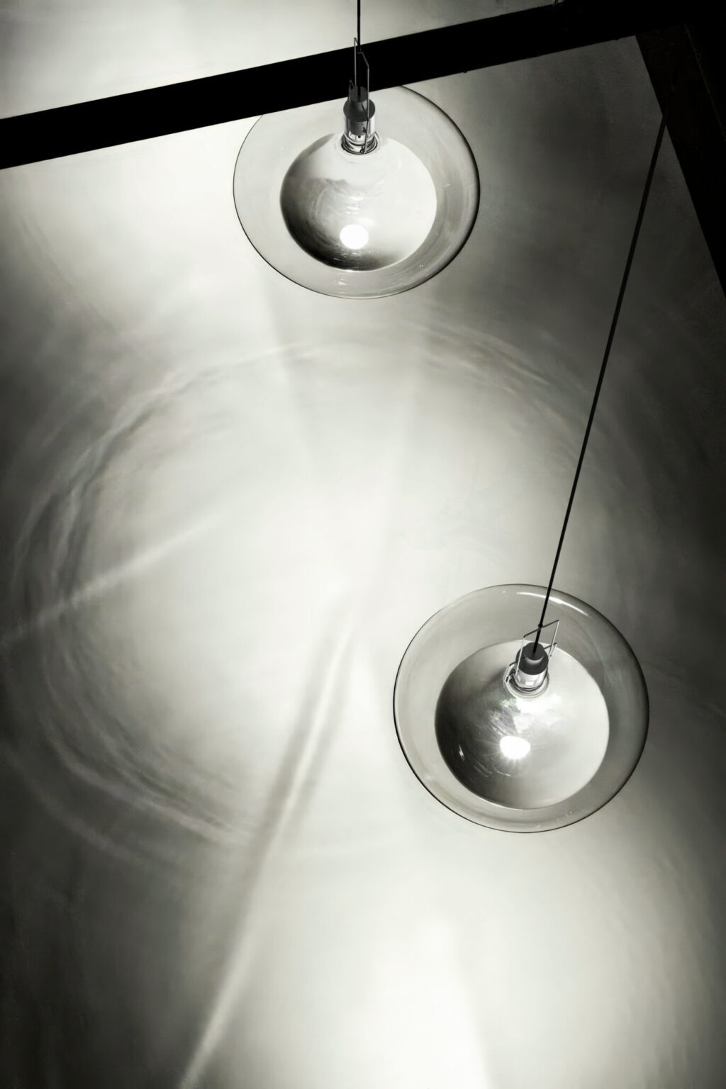 FLUID, WonderGlass. Design by Nao Tamura. | From above: the light pools on the floor, ring after ring.