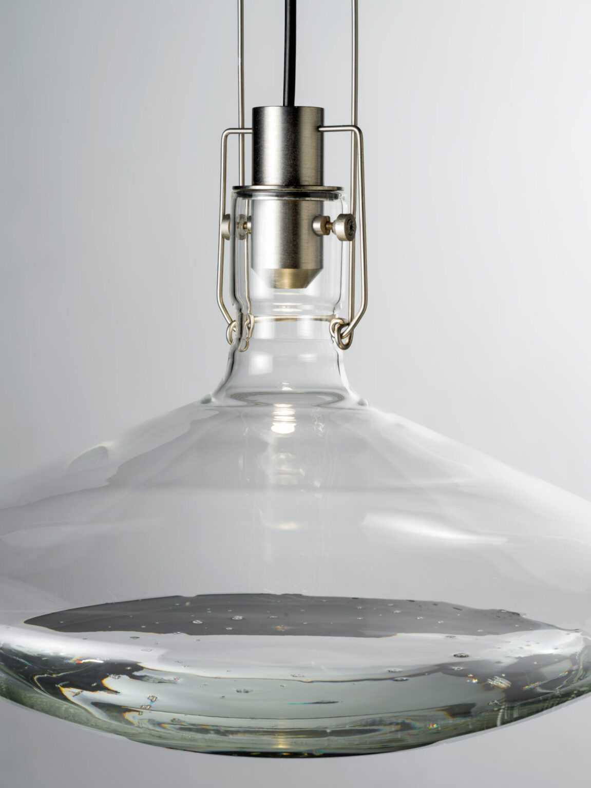 FLUID, WonderGlass. Design by Nao Tamura. | Brushed steel holds the neck; everything else is left to the glass.