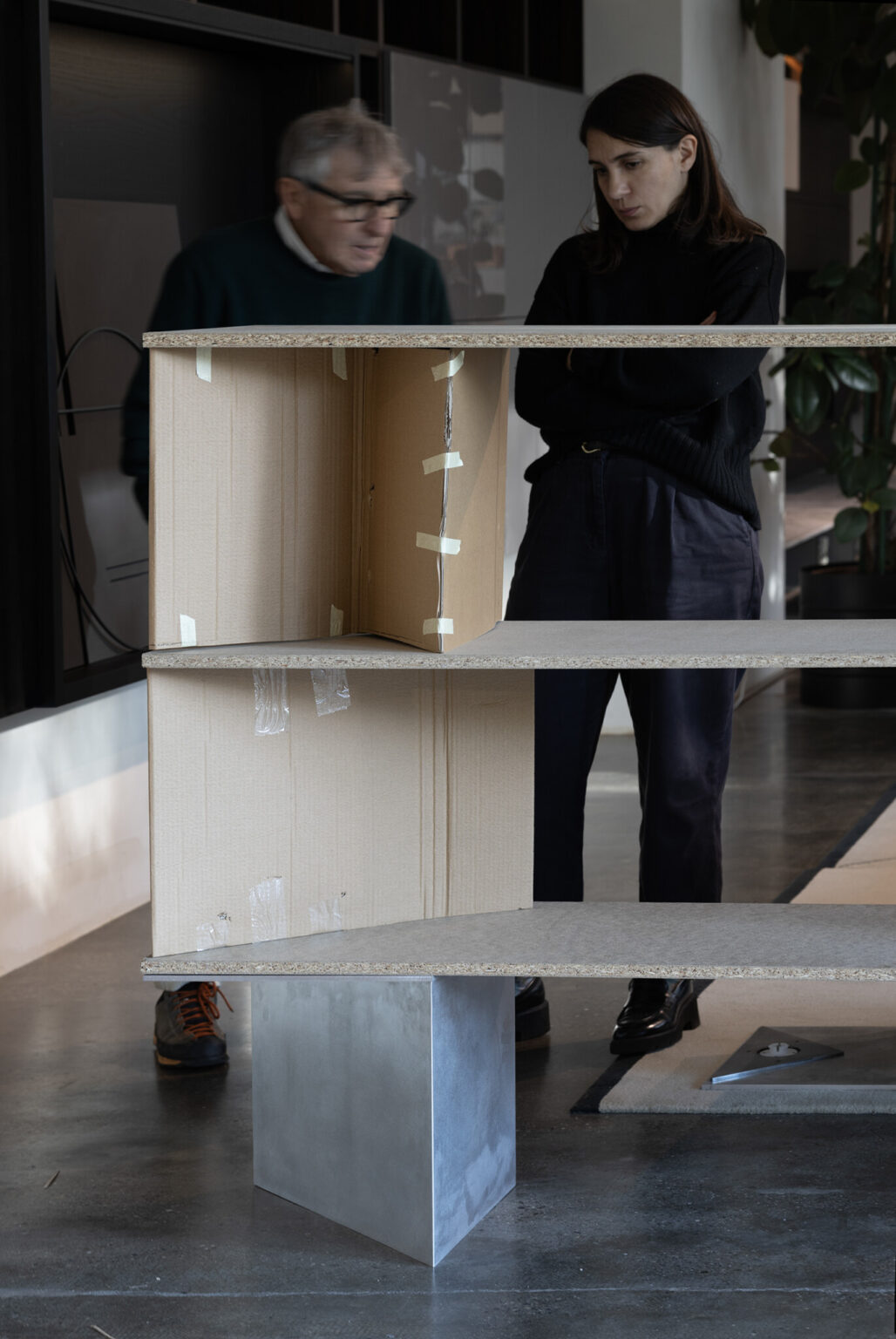 RYO, Porro. Design by Nao Tamura. | Full-scale study—cardboard and particleboard standing in for aluminum, one metal module already in place.